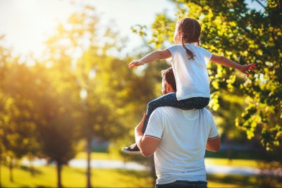 Father with daughter on shoulders