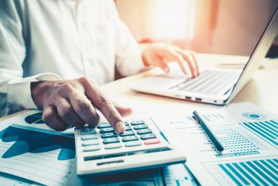 businessman with calculator and computer